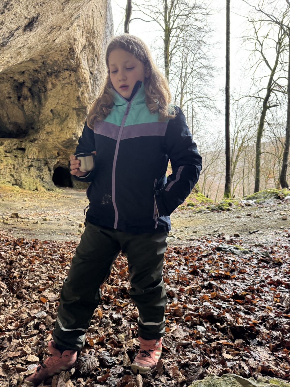 Mathilde on a woodland walk with a mug of tea